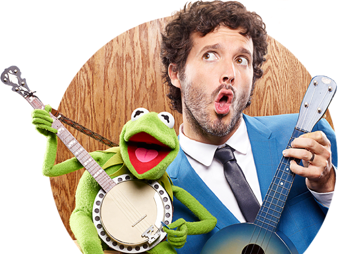Bret McKenzie and Kermit the frog singing with a microphone
